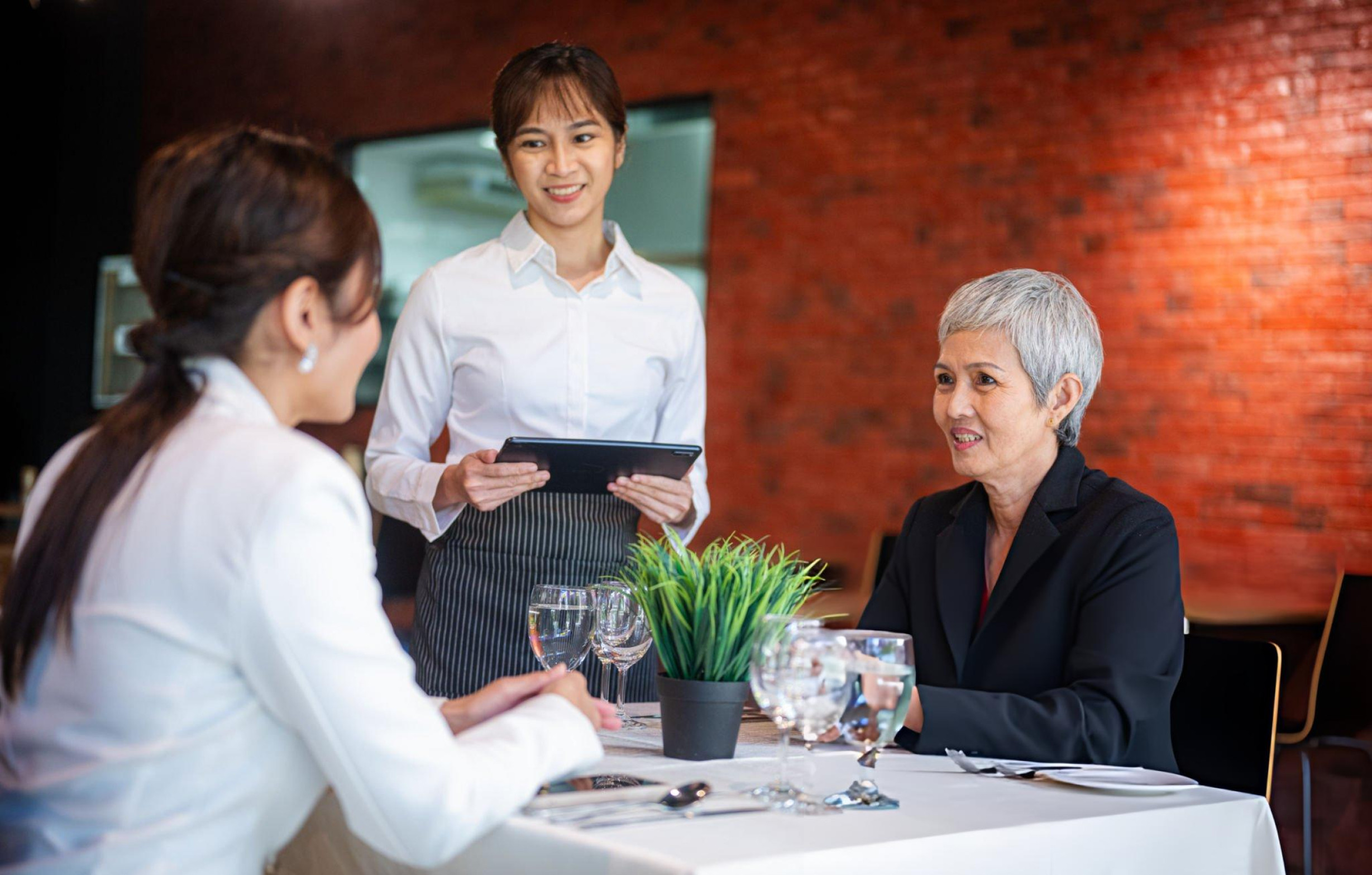 A Waitress Serve the Costumers